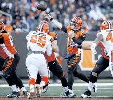  ?? JOE ROBBINS/GETTY IMAGES ?? Cincinnati Bengals’ quarterbac­k Andy Dalton throws a pass against the Cleveland Browns in the first half of a game, at Paul Brown Stadium, on Nov. 26, in Cincinnati, Ohio.