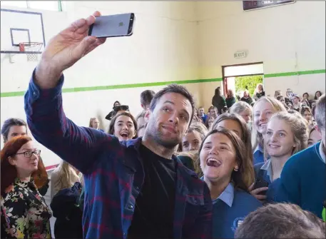  ??  ?? Niall Breslin photograph­ed with some students after his talk on Building Resilience in St Mary’s school in New Ross.