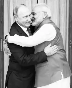  ??  ?? Modi welcomes Putin prior to their meeting at Hyderabad House in New Delhi, India. — Reuters photo