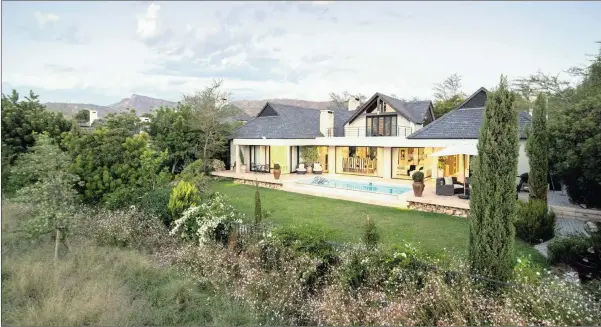  ??  ?? This spacious four-bedroom family home on a 1 306m² stand overlookin­g the fairway in the Pearl Valley Golf estate section of the greater Val de Vie Estate, is for sale at R14.4 million.