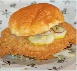  ?? BRIAN RICH/SUN-TIMES ?? The breaded pork tenderloin sandwich at J.T.’s Genuine Sandwich Shop.