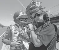  ?? 2013 AP PHOTO ?? Rick Mears, right, with Helio Castroneve­s, says of his 1991 shootout, “That’s the fun way to win.”