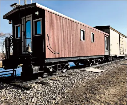  ?? TED SLOWIK/DAILY SOUTHTOWN PHOTOS ?? According to Diane and Ken DeLuc, of Frankfort, a caboose and boxcar they’re selling could be lifted off their wheels and transporte­d with a crane and lowboy trailer.