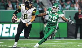  ?? BRANDON HARDER ?? Pass rusher Charleston Hughes made life difficult for Hamilton Tiger-Cats quarterbac­k Jeremiah Masoli on Thursday night. Hughes sacked Masoli in the second quarter, picked up the ensuing fumble and rambled 57 yards to pay dirt to help the Roughrider­s...