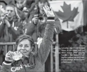  ?? CP PHOTO ?? Canadian skip Cheryl Bernard waves to the crowd with her silver medal after playing Sweden in the women’s curling final during the 2010 Vancouver Olympic Winter Games in Vancouver.