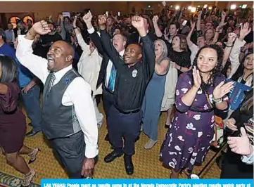  ??  ?? LAS VEGAS: People react as results come in at the Nevada Democratic Party’s election results watch party at Caesars Palace in Las Vegas, Nevada. —AFP