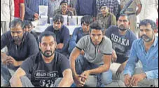  ?? HT PHOTO ?? The accused in police custody on Tuesday. Police had announced a reward of ₹7 lakh on one of the men arrested.