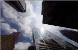  ?? CP PHOTO ADRIEN VECZAN ?? Bank towers are shown from Bay Street in Toronto’s financial district. Toronto is getting itself a new resident this year: the headquarte­rs of the federal government’s new infrastruc­ture financing agency.