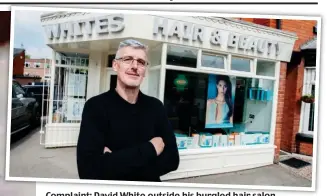  ??  ?? Complaint: David White outside his burgled hair salon