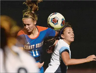  ?? DANA JENSEN/THE DAY ?? Valerie Hines (11) of Coast Guard and Zoe Stublarec, right, of Connecticu­t College both go up to head the ball during Wednesday’s women’s soccer game at Conn’s Silfen Field in New London. Conn won 1-0.