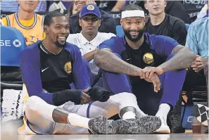  ?? KYLE TERADA/USA TODAY ?? Like many of the Warriors in the preseason, Kevin Durant, left, and DeMarcus Cousins have been mostly all smiles, despite going 1-4.