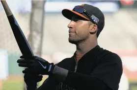  ?? Stephen Lam / Special to The Chronicle ?? Travis Ishikawa takes batting practice at AT&T Park. Ishikawa says he can no longer walk anonymousl­y around San Francisco since his dramatic home run.