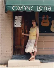  ?? PHOTO PROVIDED ?? Founder Lena Spencer opens the door of Caffè Lena in Saratoga Springs.