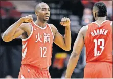  ?? [ERIC CHRISTIAN SMITH/THE ASSOCIATED PRESS] ?? Houston’s Luc Mbah a Moute, left, and James Harden celebrate during Wednesday’s win over the Kings in Houston.