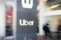  ?? JOSH EDELSON AFP VIA GETTY IMAGES FILE PHOTO ?? Under mounting pressure to turn its first profit, Uber has moved to unload even more units, like Serve Robotics, and make more investment­s.