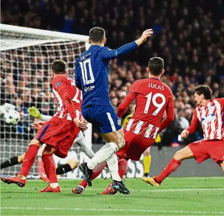  ?? — AFP ?? Heartbreak: Atletico Madrid’s Stefan Savic (right) blocking a shot by Chelsea’s Eden Hazard which resulted in an own goal at Stamford Bridge on Tuesday.