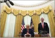  ?? EVAN VUCCI-ASSOCIATED PRESS FILE ?? Pastor Robert Jeffress and President Donald Trump pray after Trump signed a full pardon for Alice Johnson in the Oval Office of the White House, Friday, Aug. 28, 2020, in Washington.