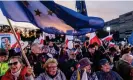  ?? Radwański/AFP/Getty ?? People wave Polish and EU flags outside a TV studio before an election debate debate earlier this month. Photograph: Wojtek