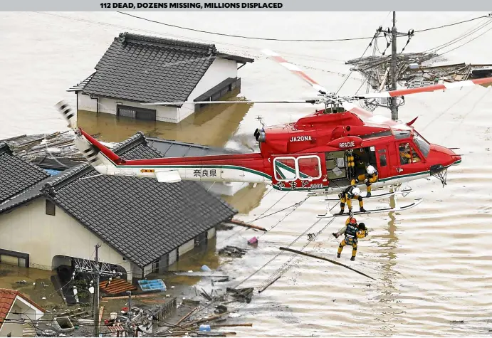  ?? —AP ?? HARD-HIT CITY Rescuers pluck a woman from her flooded home in the hard-hit city of Kurashiki, Okayama prefecture, where thousands have flocked to evacuation centers. Nobody has anything to wear, says Kurashiki Mayor Kaori Ito. “Weneed shirts, trousers, underwear, socks and even shoes.”