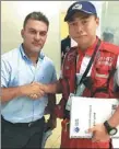  ?? PROVIDED TO CHINA DAILY ?? Pearl Humanitari­an Rescue founder Xue Yu meets Jose Serrano, Ecuador’s minister of internal affairs in Quito, Ecuador.