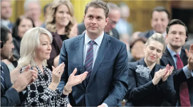  ?? JUSTIN TANG / THE CANADIAN PRESS ?? Andrew Scheer is keen to distinguis­h his Conservati­ve Party from the Liberals but pandering to protection­ists is wrong, John Ivison writes.