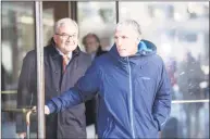  ?? Scott Eisen / Getty Images ?? William “Rick” Singer leaves Boston Federal Court after being charged with racketeeri­ng conspiracy, money laundering conspiracy, conspiracy to defraud the United States and obstructio­n of justice on Tuesday.