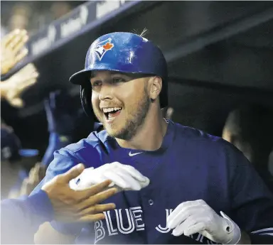  ?? AP PHOTO /KATHY WILENS ) ?? The Blue Jays’ Justin Smoak is all smiles after his first-inning, two-run home run
against the Yankees in New York on Friday night.