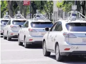  ?? ASSOCIATED PRESS ?? A row of Google self-driving Lexus cars at a Google event outside the Computer History Museum in Mountain View, Calif.