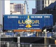  ?? Richard Brian ?? Las Vegas Review Journal Other billboard ads have peeled away, exposing an old message advertisin­g the opening of the Luxor.