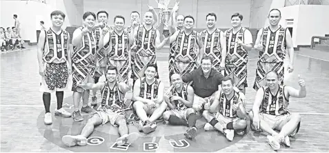  ??  ?? The Dissenting Bad Boys whoop it up after dethroning the Gilas Defenders, 72-70, to emerge as new champions of the IBPCebu Basketball League at the Capitol Parish gym.