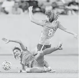  ?? Karen Warren / Houston Chronicle ?? Dash forward Rachel Daly battles Sky Blue FC defender Erica Skroski (8) for control of the ball in the first half of Friday’s game at BBVA Compass Stadium.