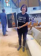  ?? CARLA HINTON/THE OKLAHOMAN ?? Nancy Vollertsen holds up a picture of her brother, Greg Wilhoit, at the gathering.