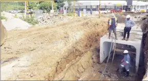  ?? (Courtesy pic) ?? Workers from the Municipal Council of Mbabane installing the culvert pipes in an effort to address the flooding challenges at the Mbabane Mall.