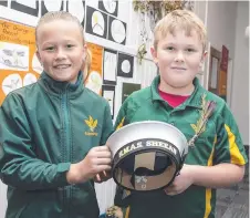  ??  ?? Bella Sheean and Andrew Jarvie, whose great-great uncle was Edward 'Teddy' Sheean, with a sailor's cap from HMAS Sheean during a school visit by crew from the Sheean and HMAS Armidale. Picture: Department of Defence