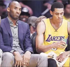  ?? Robyn Beck Agence France-Presse/Getty Images ?? KOBE BRYANT has won five NBA titles in L.A., but a shoulder injury sidelined him for most of this season as rookie Jordan Clarkson (6) and Lakers went 21-61.