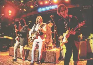  ?? Tim Mosenfelde­r Getty Images ?? MUDCRUTCH RE-FORMED for a 2008 album and the band toured to support it, including at the Troubadour on May 1, 2008, in West Hollywood. From left are Campbell, Petty and Leadon.