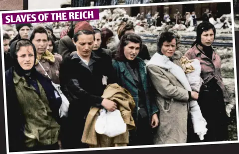  ??  ?? A group of Jewish women selected for slave labour, with the discarded belongings of those sent straight to their deaths piled up in the background. They would be sent to other camps to work on armaments and rockets
