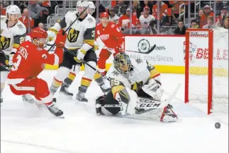  ?? Paul Sancya ?? The Associated Press Golden Knights goaltender Marc-andre Fleury stops a shot by Red Wings defenseman Nick Jensen during the second period of Vegas’ 4-0 victory Thursday in Detroit.