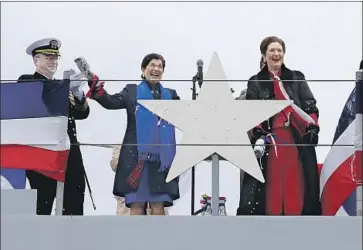  ?? Robert F. Bukaty Associated Press ?? PRESIDENT Lyndon B. Johnson’s daughters, Luci Baines Johnson, left, and Lynda Bird Johnson Robb, after christenin­g a high-tech Navy destroyer named for their father at Bath Iron Works in Maine.