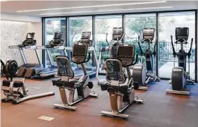  ?? Courtesy of The River Oaks ?? On-site luxury workout rooms with a range of equipment are convenient for residents.