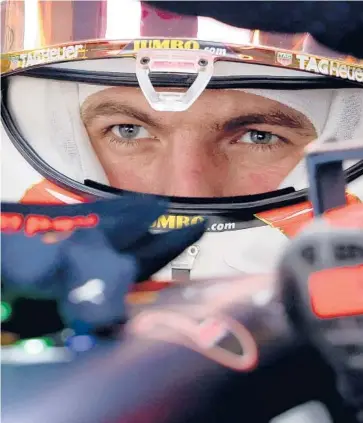  ?? GIUSEPPE CACACE/GETTY ?? Red Bull’s Dutch driver Max Verstappen sits in his car in the pits of the Yas Marina Circuit on Friday.