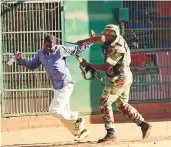  ?? AFP ?? A man (above left) lies on the ground after the Zimbabwean army opened fire in central Harare yesterday, while a Zimbabwean soldier (above right) beats a man in a street of Harare yesterday as protests erupted over alleged fraud in polls.