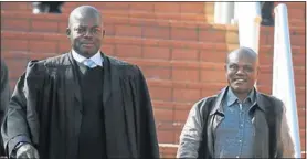  ?? Picture by Bafana Mahlangu ?? SCOT FREE: MP Mnyamezeli Booi, right, leaving the Randburg Magistrate­s Court.