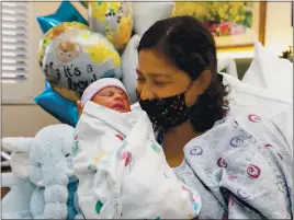  ?? RICHARD GREEN FOR SALINAS VALLEY MEMORIAL HEALTHCARE ?? Maria Flores Velasco gave birth to a baby boy at 12:06 a.m.
New Year’s at Salinas Valley Memorial Hospital, making Manuel de Jesus the first baby born in Monterey County in 2021.