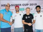  ?? HT PHOTO ?? ▪ Bengaluru FC’s Gurpreet Sandhu (left) shakes hands with Eduardo Ferreira, along with BFC and East Bengal coaches.