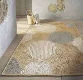  ?? ?? Circles Jute and Cotton Flatweave Rug, £129, (120x170cm), the Rug Seller