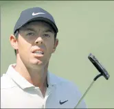  ??  ?? PUSHING THROUGH: Friday’s second round of the Masters wasn’t easy for Rory McIlroy (left) and Jordan Spieth, but two of the world’s best are still in contention heading into the weekend at Augusta National.