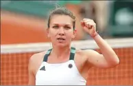  ?? DAVID VINCENT / AP ?? Romania’s Simona Halep clenches her fist after defeating Karolina Pliskova of the Czech Republic during their semifinal match at Roland Garros on Thursday.