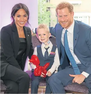  ?? Pictures: Antony Thompson/WellChild. ?? Little star: McKenzie with the Duchess and Duke of Sussex and, left, with mum Amy.