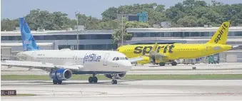  ?? WILFREDO LEE/AP FILE ?? JetBlue Airways is trying to buy Spirit Airlines for $3.8 billion.